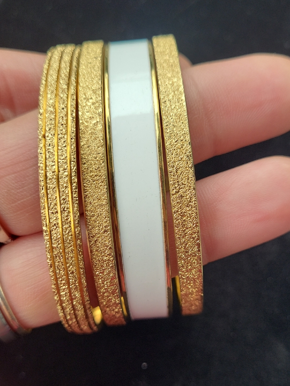 Gold and White Textured Stackable Bangle Bracelet Set. Monet